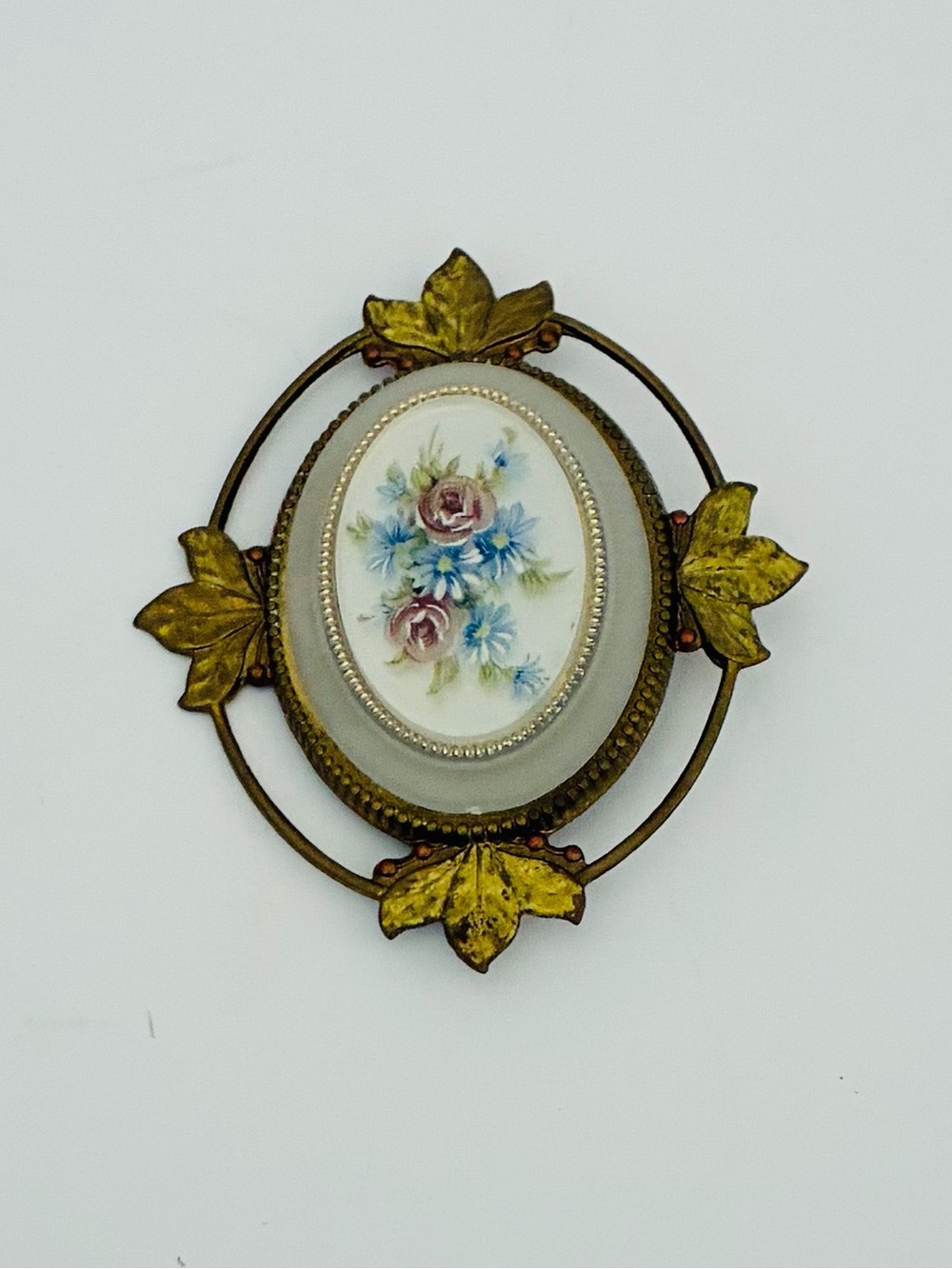 Vintage Oval Brooch Hand-Painted  Floral Center Piece Metal Frame Leaf Accents
